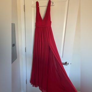 Long red dress with slit.